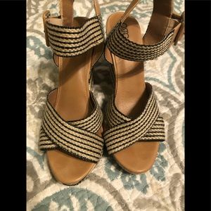 Wedge heels with buckle straps.